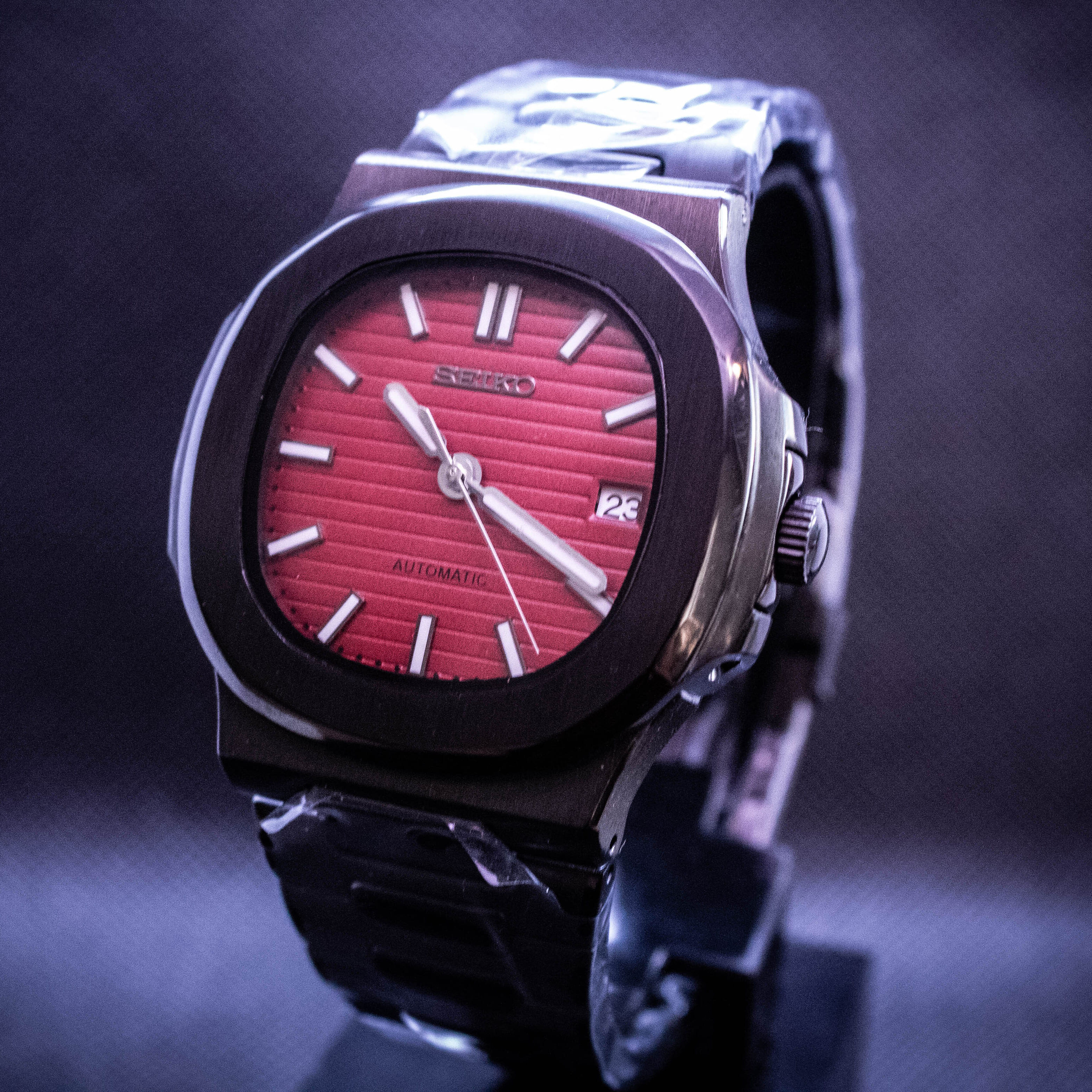 Black Seiko Nautilus with red dial